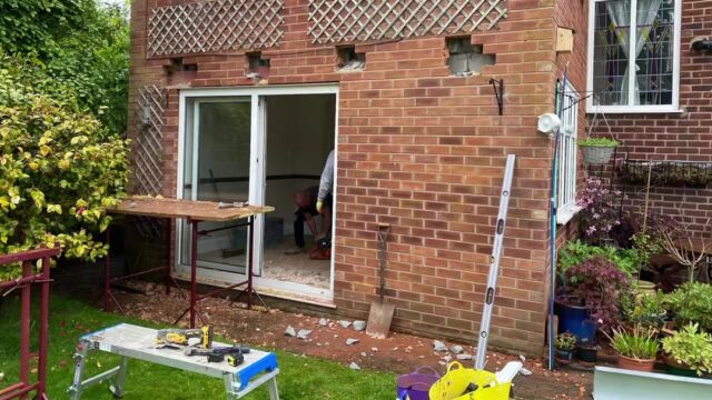 Rock door installation with uPVC window replacement